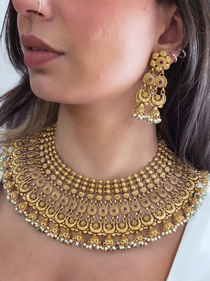 Broad choker set with circular tukdies and half jhoomki aqua bead design