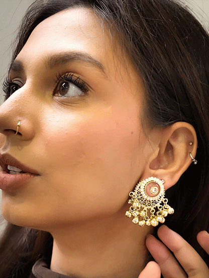 Circular coloured stone pirohi earrings with ghunghru hangings and kundan in middle