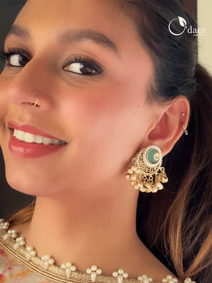 Circular coloured stone pirohi earrings with ghunghru hangings and kundan in middle