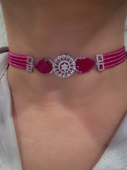 Circular center AD flower with side tear shaped stone and four onyx bead strings set