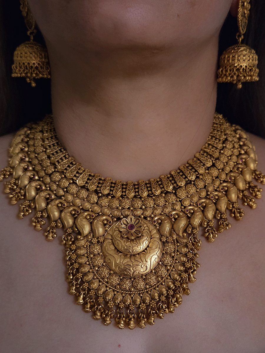 9cm circular design center with ruby stone flower broad set with peacock motif's