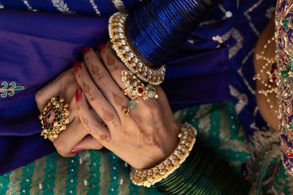 Paachi kundan pirohi work ruby and green stones studded adjustable ring with three aqua bead drops