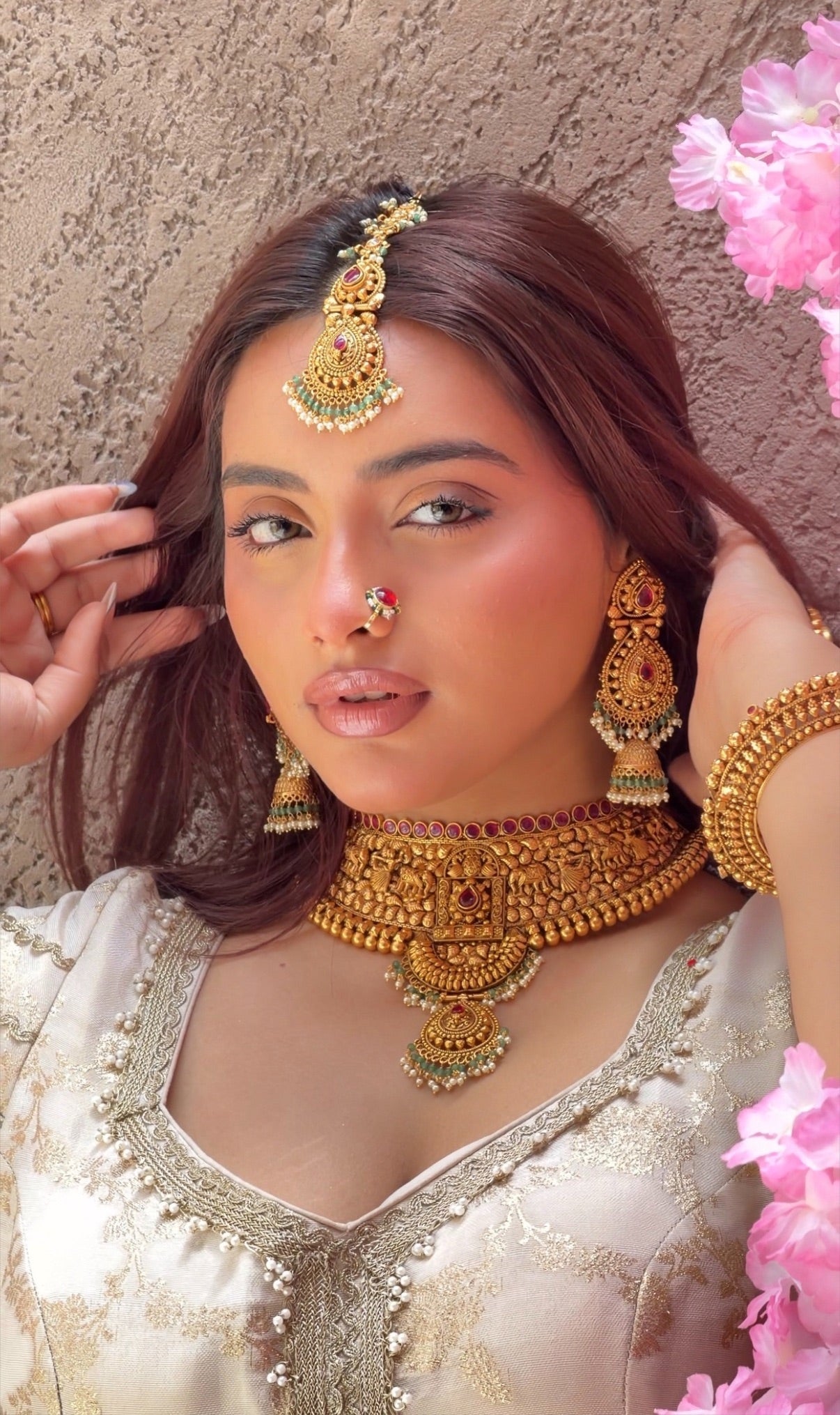 Ruby stone top line of 11cm broad choker set with nrityangna's and elephants and leaf shaped hanging tukdi in center