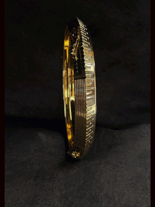 Rhodium and gold plated men's kada with jaguar design on one side and dotted rhodium design on other