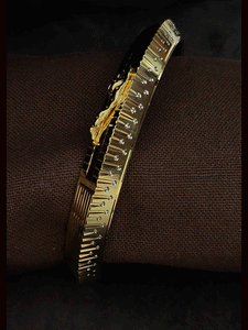 Rhodium and gold plated men's kada with jaguar design on one side and dotted rhodium design on other