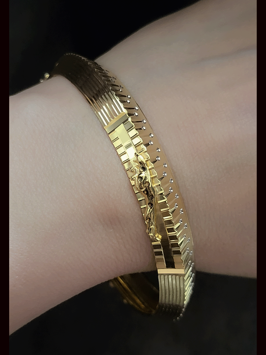 Rhodium and gold plated men's kada with jaguar design on one side