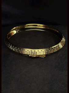 Rhodium and gold plated men's kada with jaguar design on one side and dotted rhodium design on other