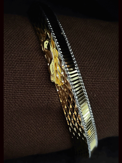 Lines on one side and Jaguar motif wavy design  on other side of rhodium and gold plated kada