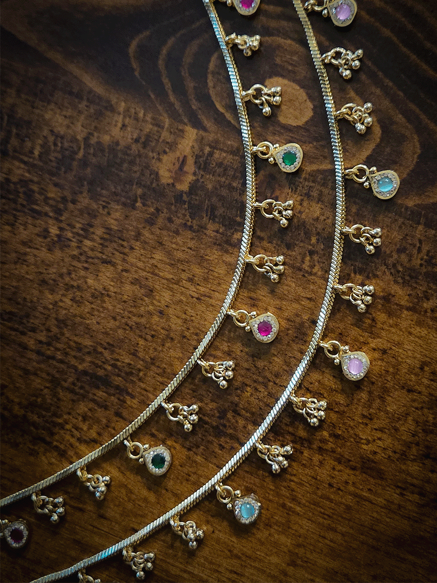 Ghunghru and Ruby and green leaf shaped hangings in chain anklets