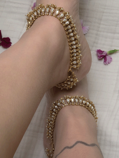 Tear shaped stones studded classy anklets with pearl and gold bead hangings