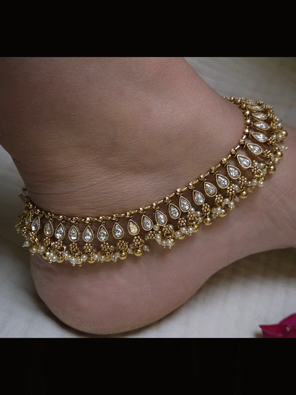 Tear shaped stones studded classy anklets with pearl and gold bead hangings