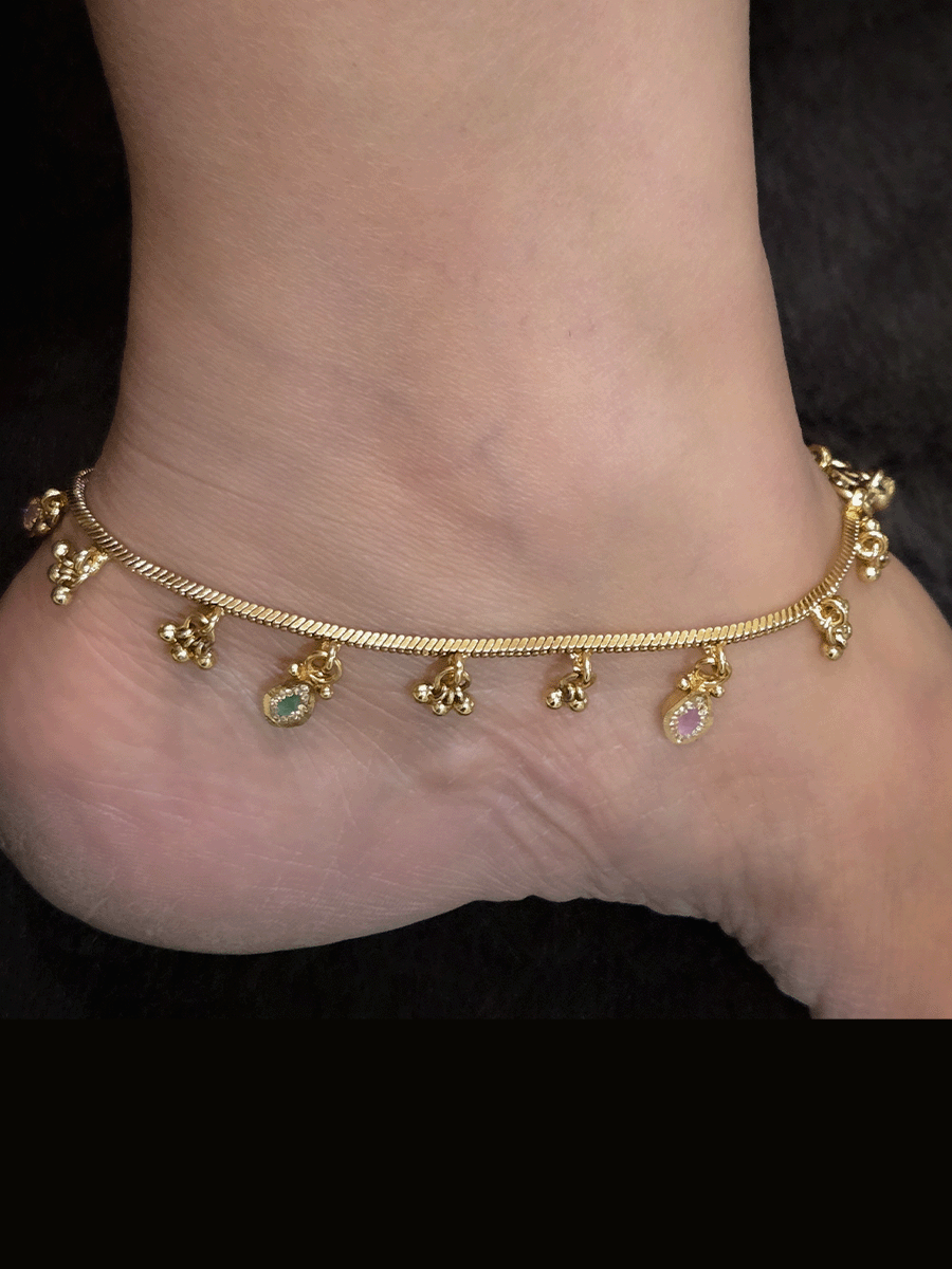 Chain anklets with leaf shaped coloured stones hanging tukdies and ghunghru hangings