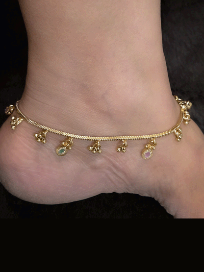 Chain anklets with leaf shaped coloured stones hanging tukdies and ghunghru hangings
