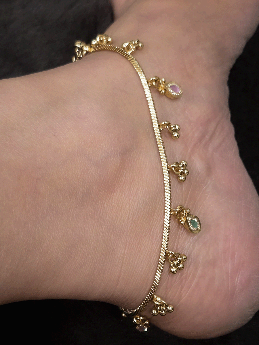 Chain anklets with leaf shaped coloured stones hanging tukdies and ghunghru hangings
