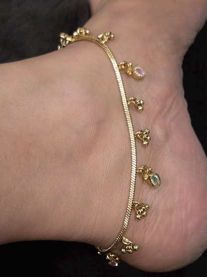 Chain anklets with leaf shaped coloured stones hanging tukdies and ghunghru hangings