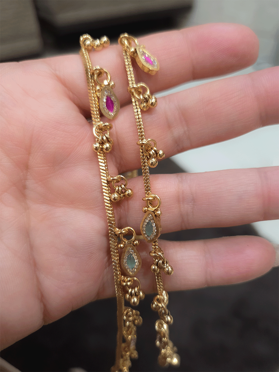 Chain anklets with leaf shaped coloured stones hanging tukdies and ghunghru hangings