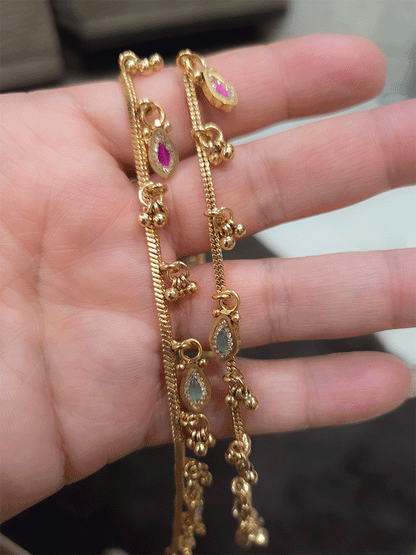 Chain anklets with leaf shaped coloured stones hanging tukdies and ghunghru hangings