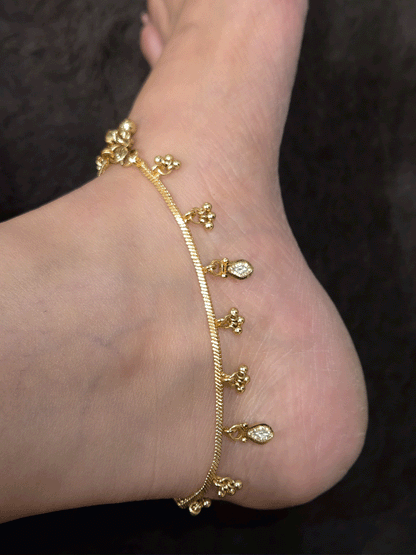 Chain anklets with leaf shaped coloured stones hanging tukdies and ghunghru hangings