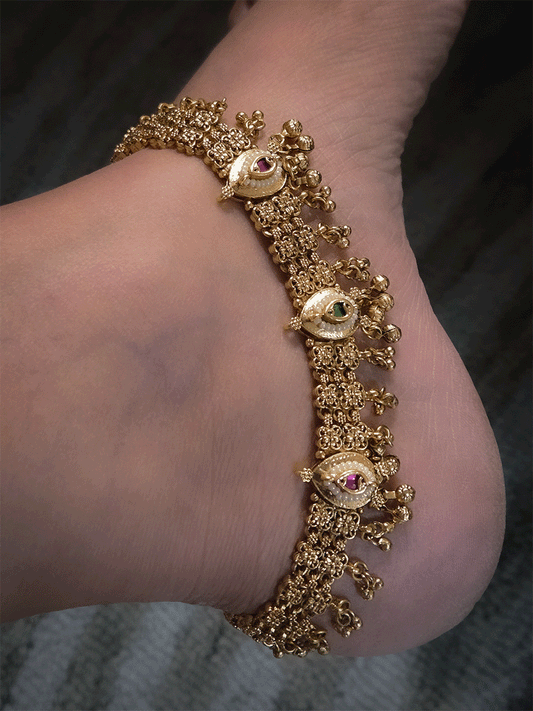 Three leaf tukdies with ruby and green stones on broad chain anklets with ghunghru hangings