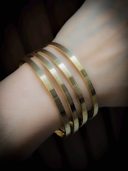 Set of four self lines design gold finish bangles(Non-openable)