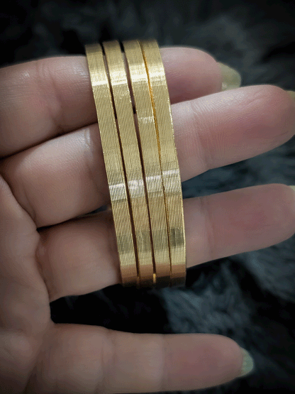 Set of four self lines design gold finish bangles(Non-openable)