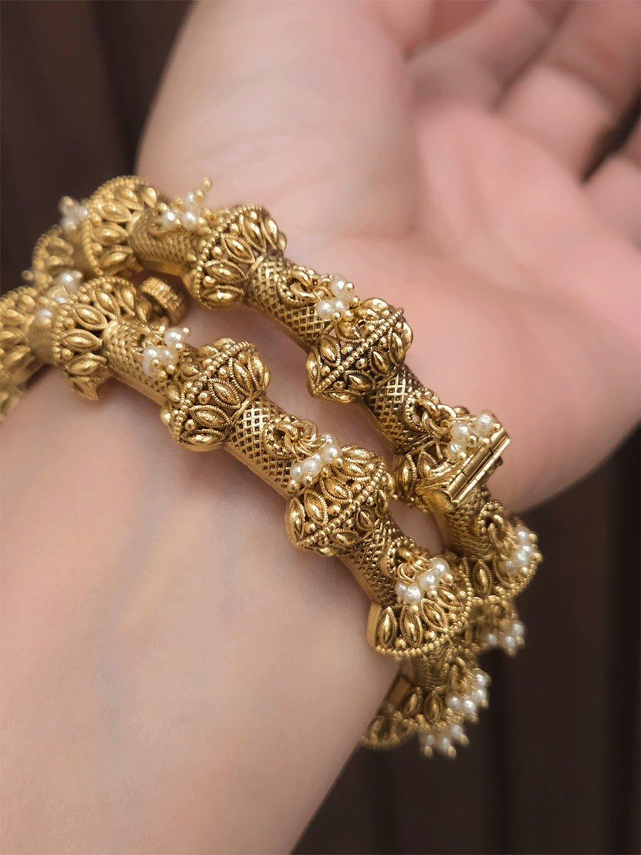 Pearly hangings in between half gold bead with leaf design openable kadas(set of two)