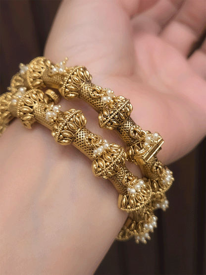Pearly hangings in between half gold bead with leaf design openable kadas(set of two)