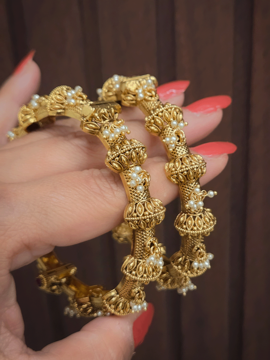 Pearly hangings in between half gold bead with leaf design openable kadas(set of two)