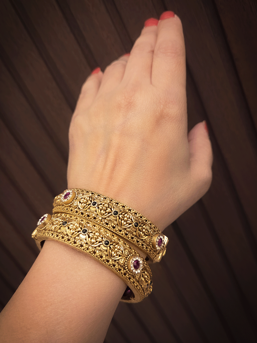 Ruby and green stones with zircon detailing flower design openable kadas(set of two)