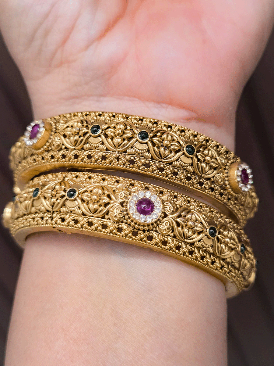 Ruby and green stones with zircon detailing flower design openable kadas(set of two)