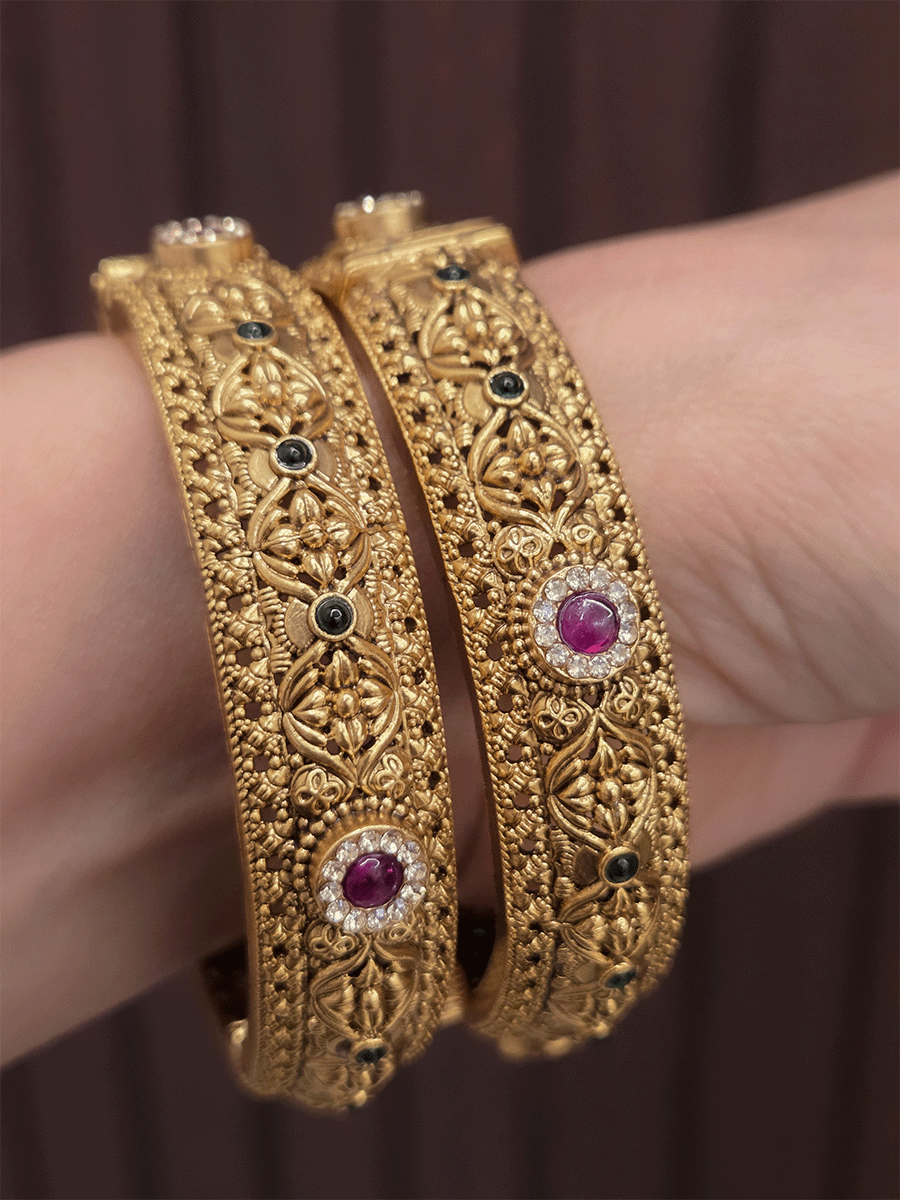 Ruby and green stones with zircon detailing flower design openable kadas(set of two)