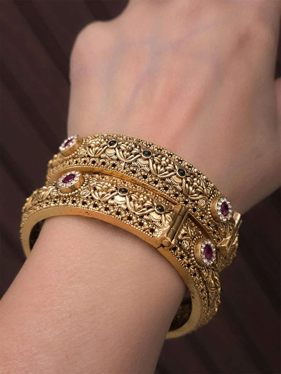 Ruby and green stones with zircon detailing flower design openable kadas(set of two)