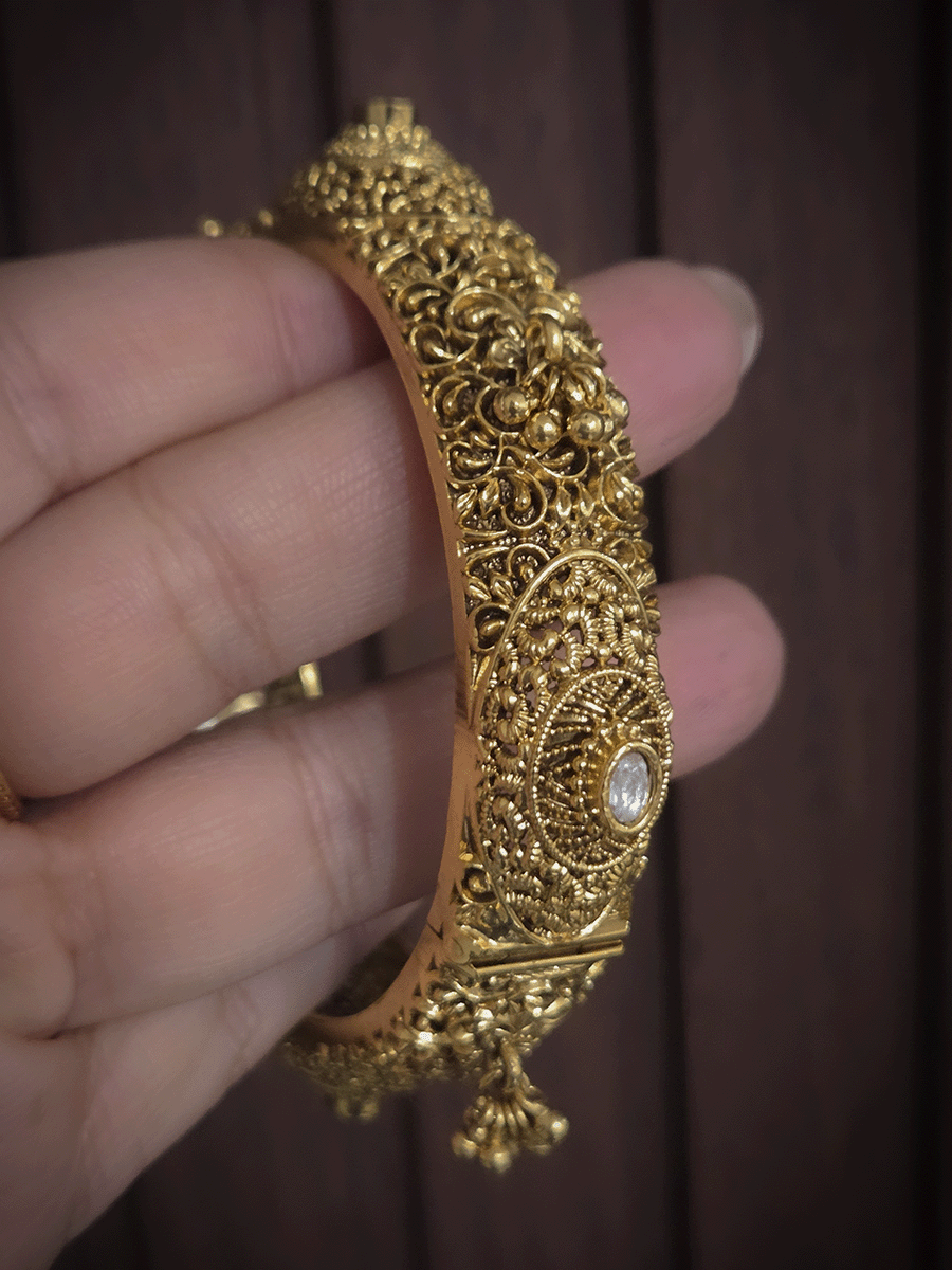 Set of two self paisley design kundan and ghunghru hangings openable kada's