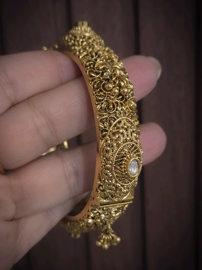 Set of two self paisley design kundan and ghunghru hangings openable kada's
