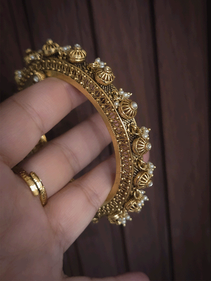 Kundan studded in wheel design set of two openable kada's with pearly hangings