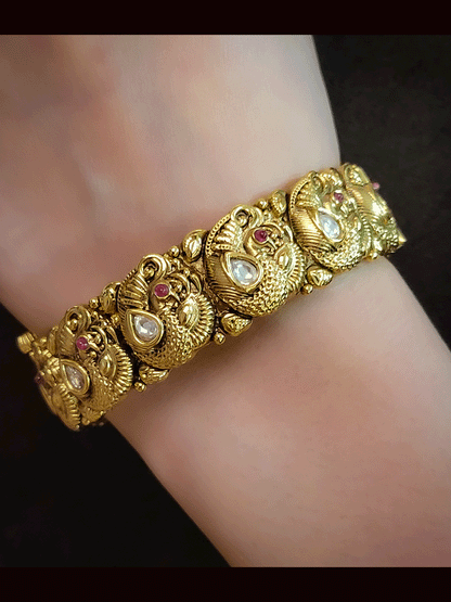 Set of two openable peacok design kadas with kundan and ruby stones