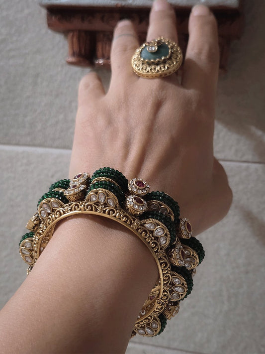 Set of two openable green bead pirohi kadas with kundan detailing on sides
