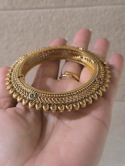 Set of two openable leaf design pacheli kada's with ruby and green stones