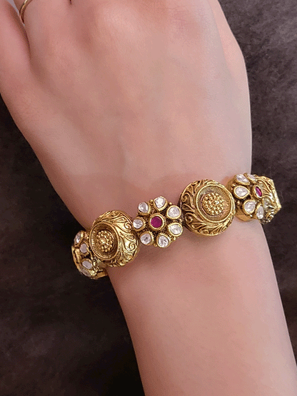 Set of two openable antique gold finish kundan flower design and circular self design kadas