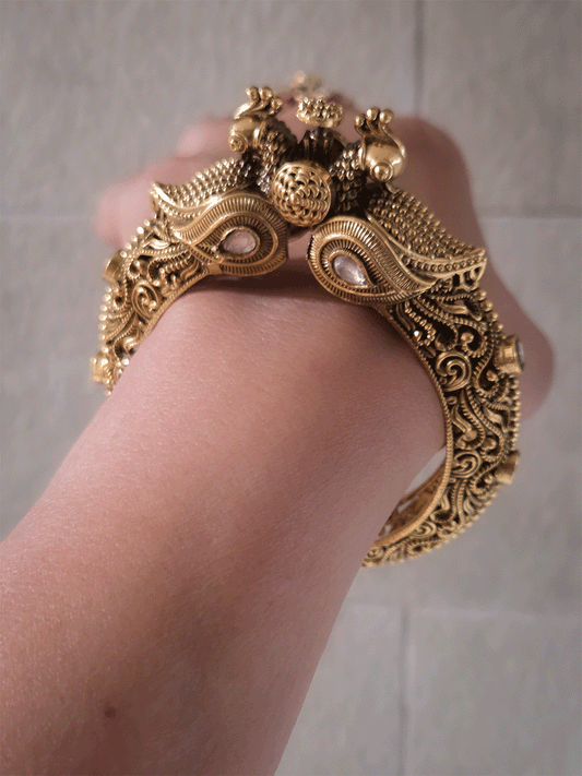 Antique gold finish kundan studded in paisley design single peacock mouth openable kada