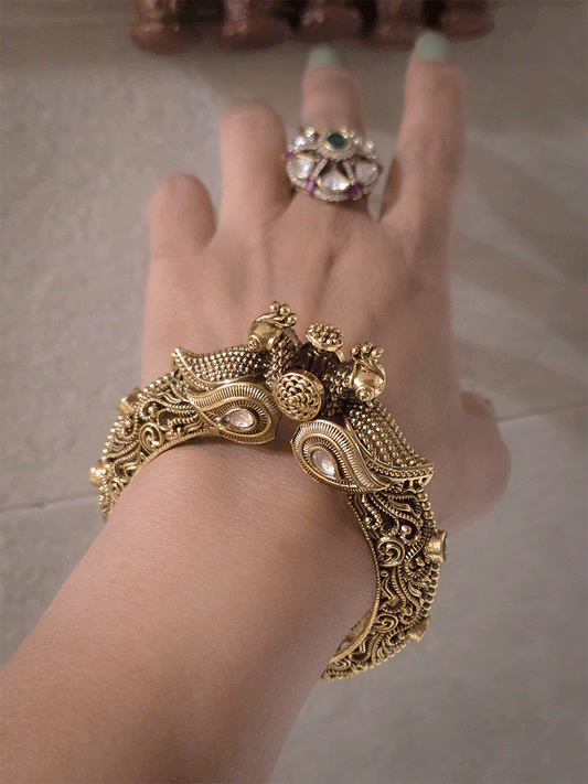 Antique gold finish kundan studded in paisley design single peacock mouth openable kada