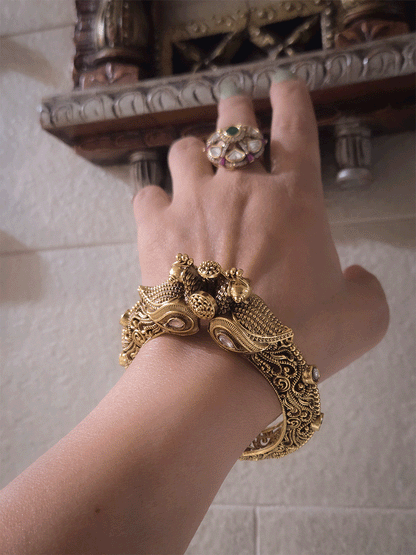 Antique gold finish kundan studded in paisley design single peacock mouth openable kada