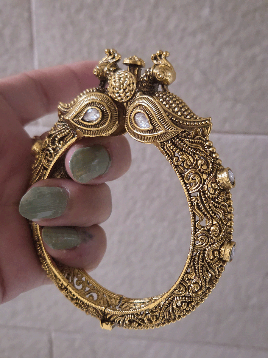 Antique gold finish kundan studded in paisley design single peacock mouth openable kada