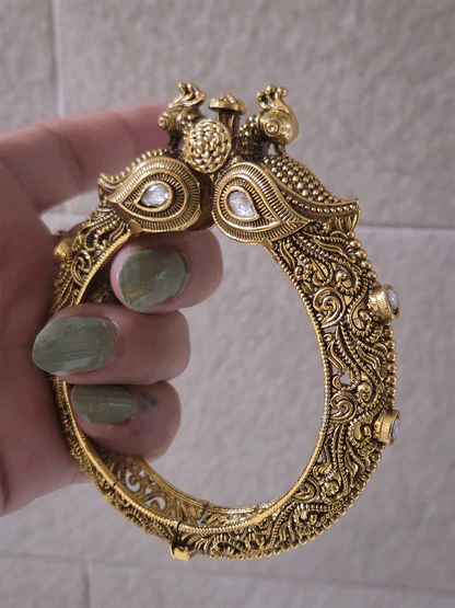 Antique gold finish kundan studded in paisley design single peacock mouth openable kada