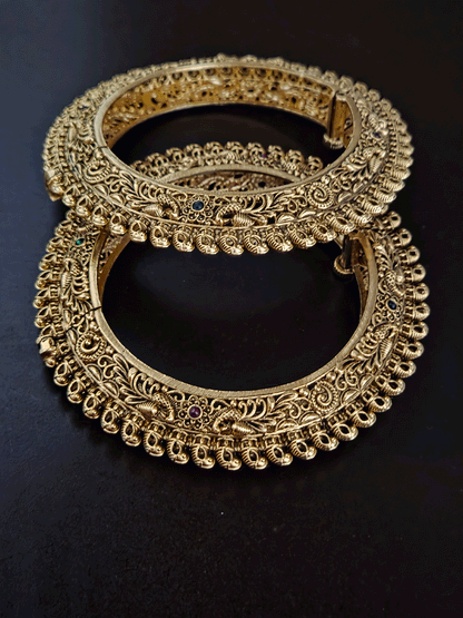Set of two intricate peacock side carving pacheli style openable kadas