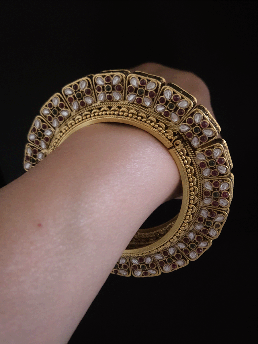 Set of two openable pacheli jadau gold top design kada's with ruby, green stones and kundan studded on sides