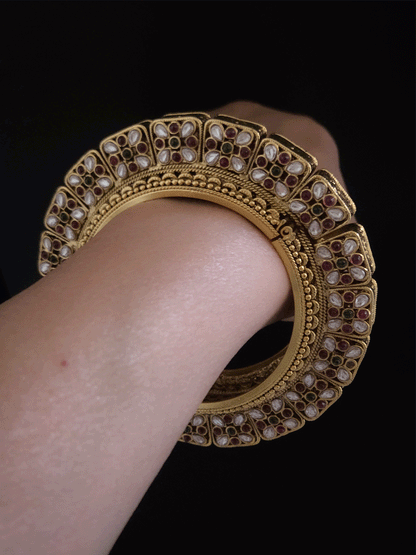 Set of two openable pacheli jadau gold top design kada's with ruby, green stones and kundan studded on sides