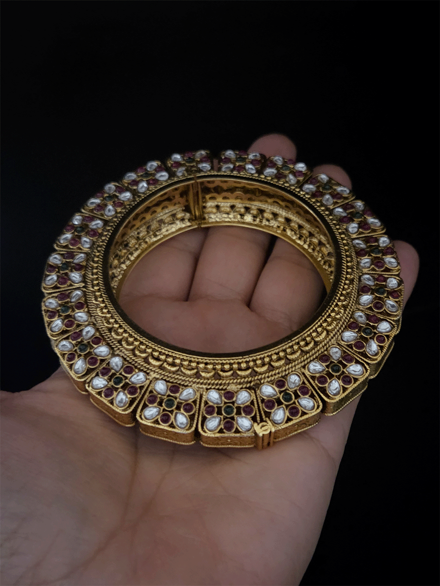 Set of two openable pacheli jadau gold top design kada's with ruby, green stones and kundan studded on sides