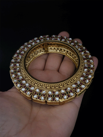 Set of two openable pacheli jadau gold top design kada's with ruby, green stones and kundan studded on sides