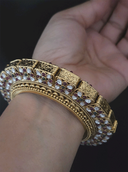 Set of two openable pacheli jadau gold top design kada's with ruby, green stones and kundan studded on sides